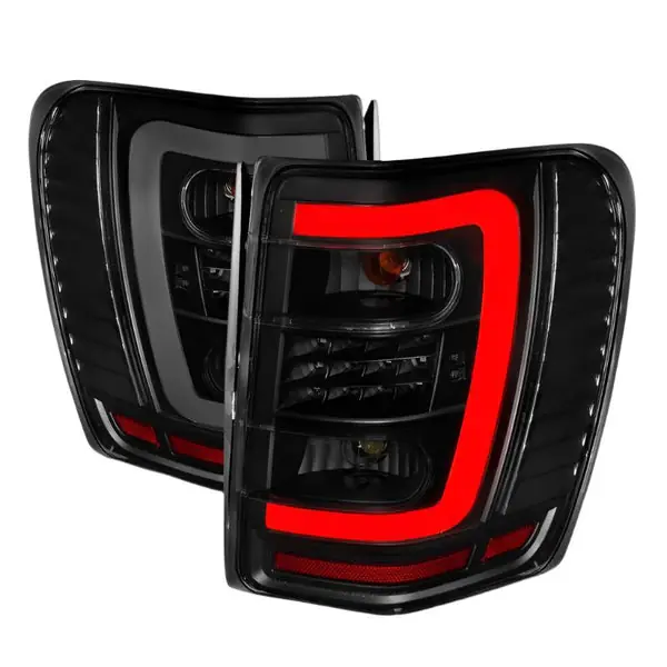 ANZO 1999-2004 Jeep Grand Cherokee LED Tail Lights w/ Light Bar Black Housing Smoke Lens